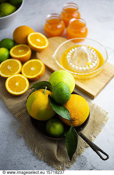 Heap of ripe citrus fruits on frying pan