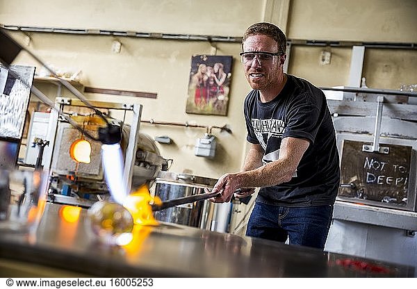 Heating glass during a glassblowing lesson at the Berlin Glas workshop in Wedding  Berlin  Germany.