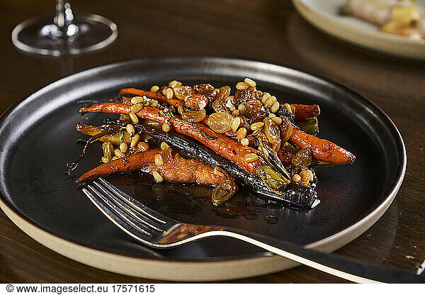Heirloom roasted carrots with a raisin pine nut chutney.
