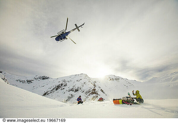 Helicopter flying away after dropping off passengers in the mountains