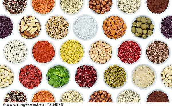 Herbs and spices vegetables background nuts from above clipping against a white background