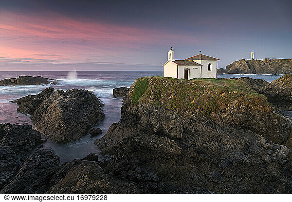 Hermitage on the cliffs of Valdoviño at sunset. Galicia  Spain.