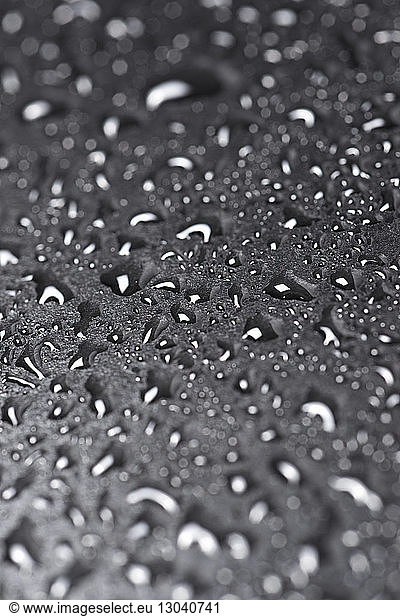 High angle close-up of wet window during rainy season