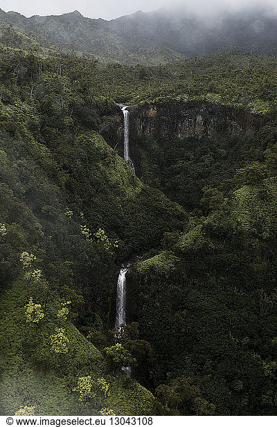 High angle scenic view of waterfalls in forest