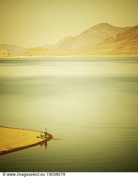 High angle view of a lone fisherman on the shore of Pyramid Lake  NV.