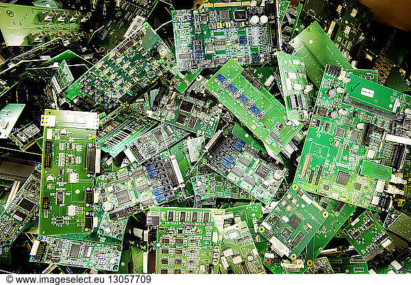 High angle view of abandoned mother boards in recycling plant