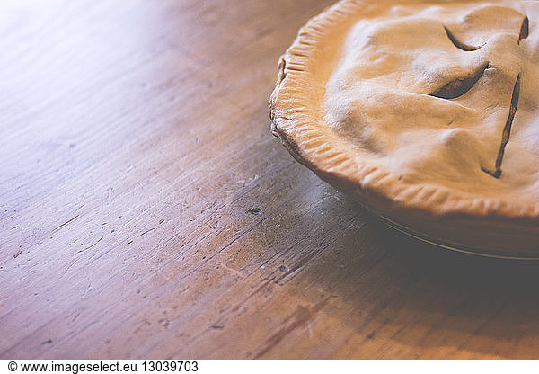High angle view of apple pie on wooden table