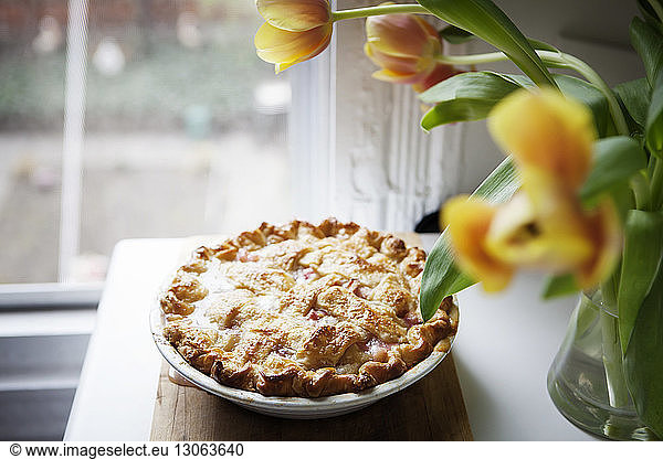 High angle view of baked rhubarb pie on wooden tray