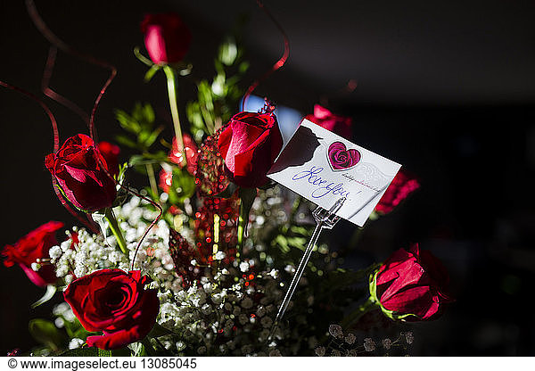 High angle view of bouquet with love you message