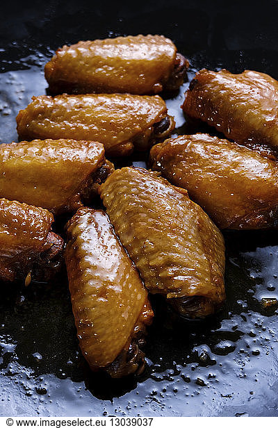 High angle view of buffalo chicken wings in cooking pan