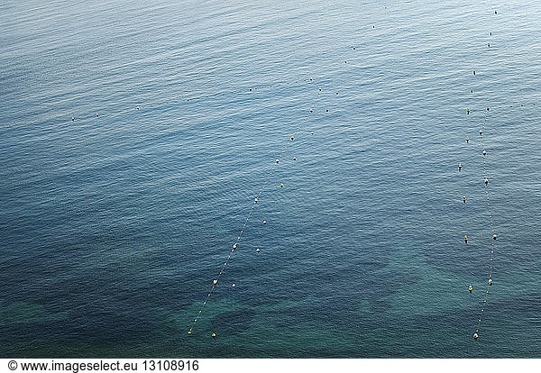 High angle view of buoys floating on sea