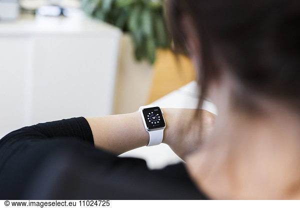 High angle view of businesswoman wearing smart watch