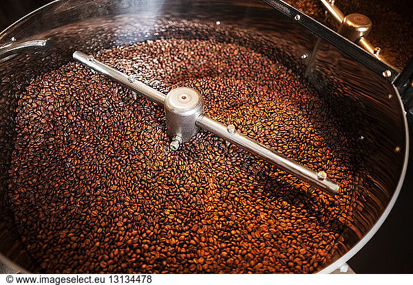 High angle view of coffee beans in coffee roaster