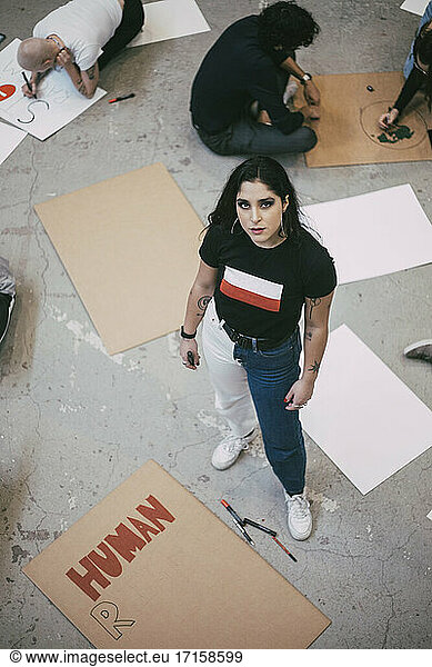 High angle view of female activist standing in building