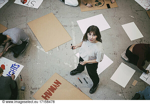 High angle view of female protestor standing in building