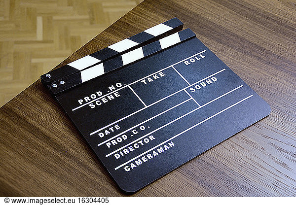 High angle view of film slate on wooden table