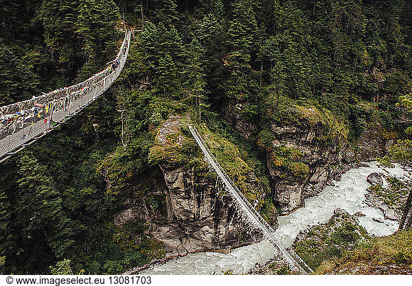High angle view of footbridges over river amidst mountain at Sagarmatha National Park
