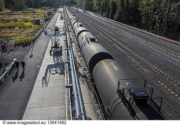 High angle view of freight train on railroad tracks during sunny day
