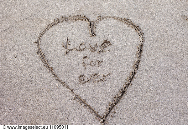 High angle view of heart shape drawn in sand on the beach  Viana do Castelo  Norte Region  Portugal
