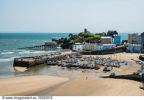 High angle view of houses  sandy beach and harbour of Tenby  Pembrokeshire  Wales  UK.