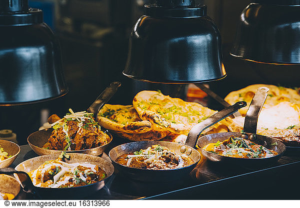 High angle view of Indian food served on concession stand of commercial land vehicle