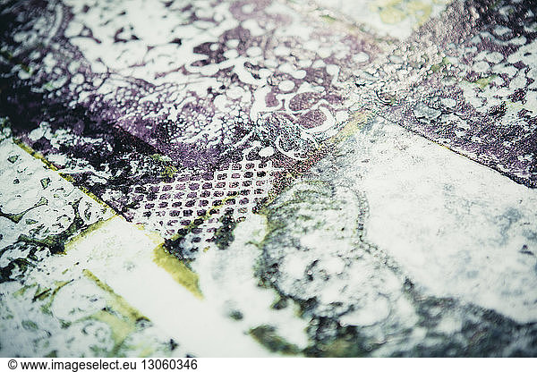 High angle view of ink prints on workbench at workshop