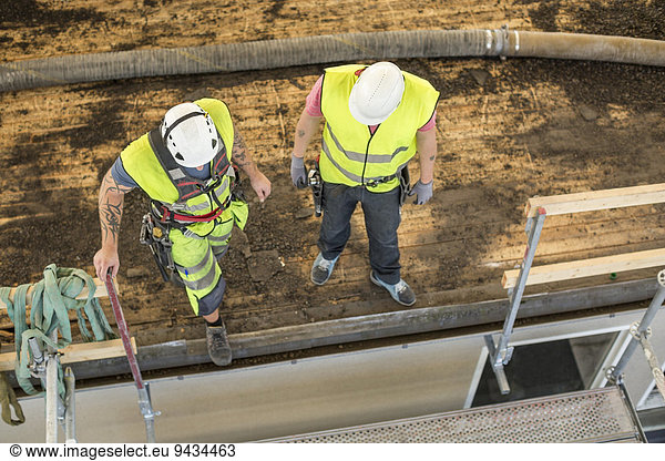 High angle view of manual workers at construction site