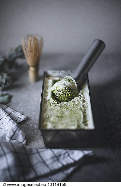High angle view of matcha green tea ice cream on kitchen counter