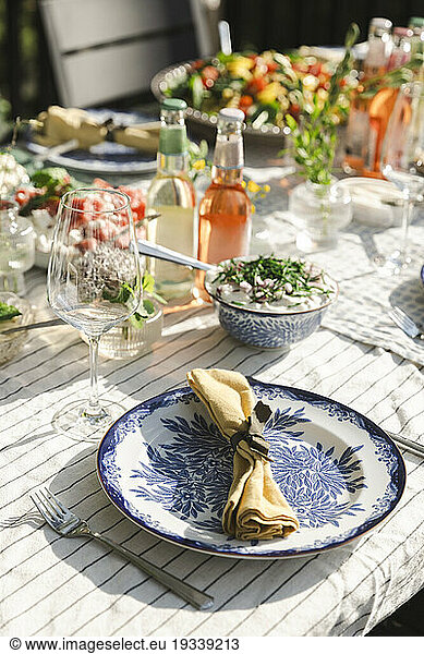 High angle view of napkin in plate on dining table