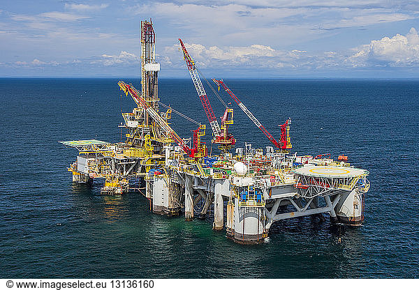 High angle view of oil exploration platform amidst sea