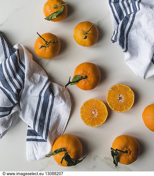 High angle view of oranges with napkins on table