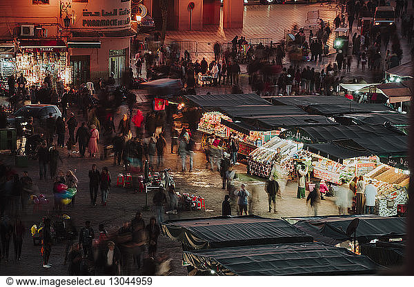High angle view of people at Marrakesh market during night