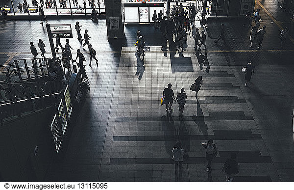 High angle view of people walking at subway station