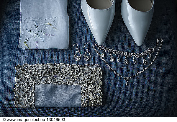 High angle view of personal accessories on table during wedding ceremony
