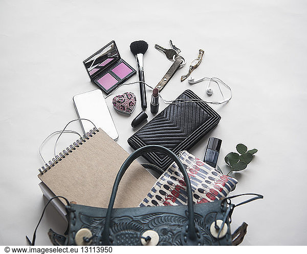 High angle view of personal accessories on white background