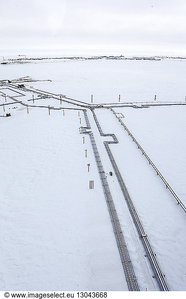 High angle view of pipeline connection on snow