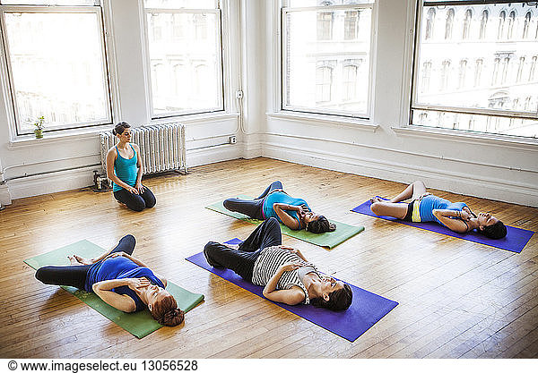 High angle view of pregnant women exercising in gym