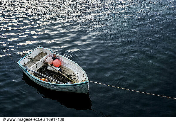 High angle view of small moored fishing boat.