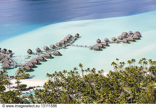 High angle view of stilt houses in lagoon of Bora Bora
