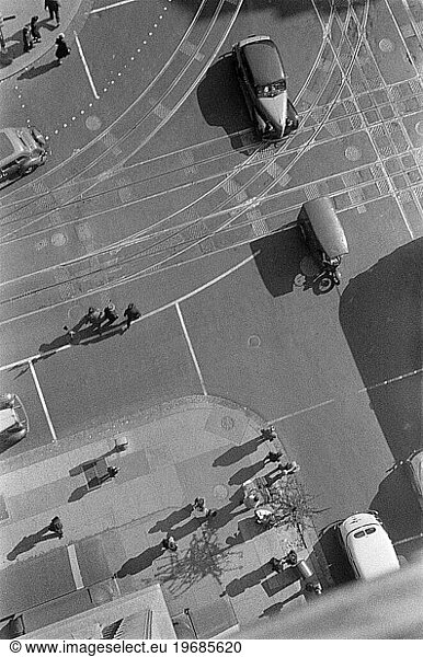 High angle view of street corner at 14th Street and Pennsylvania Avenue showing pedestrians and traffic of street cars and automobiles  Washington  D.C.  USA  David Myers  U.S. Farm Security Administration  1939