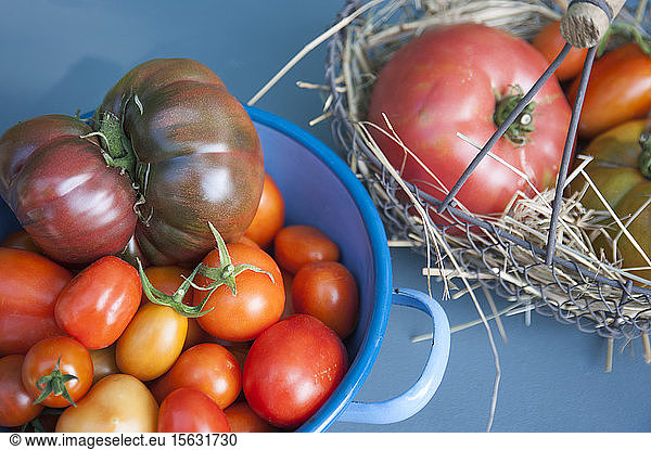 High angle view of tomatoes in containers on table