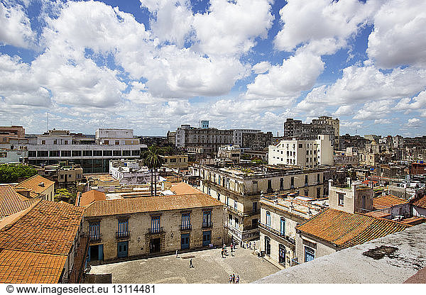 High angle view of townscape against cloudy sky
