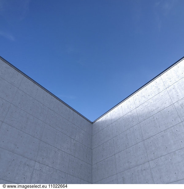 High concrete wall in front of blue sky  3D Rendering