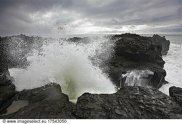 High tide waves splashing on rocks at Ponta da Ferraria  San Miguel  Azores  Portugal