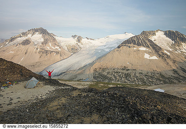 Hiker enjoys amazing view from campsite.