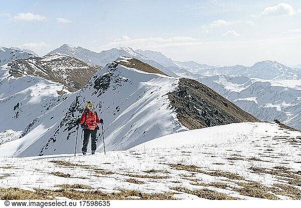 Hiker hiking on snow covered mountain  Caucasus Nature Reserve  Sochi  Russia