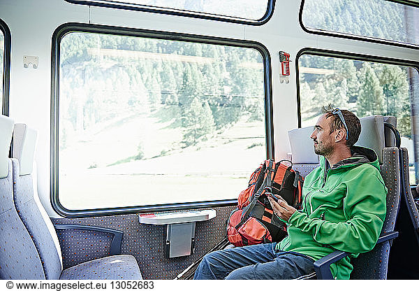 Hiker in train  Valais  Switzerland