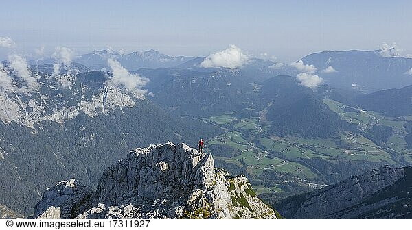 Hiker on a summit on the way to the Hochkalter  mountains and alpine foreland  Bavaria  Germany  Europe