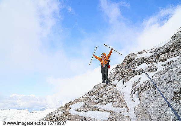 Hiker on edge of mountain side  Canazei  Trentino-Alto Adige  Italy
