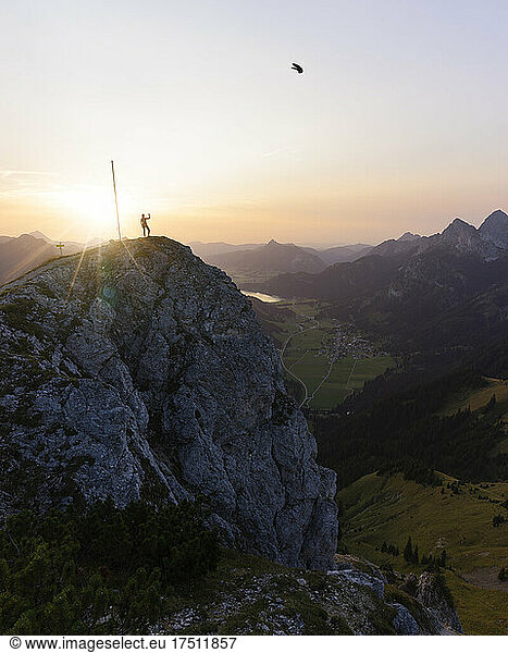 Hiker on viewpoint during sunset  Gaichtspitze  Tyrol  Austria